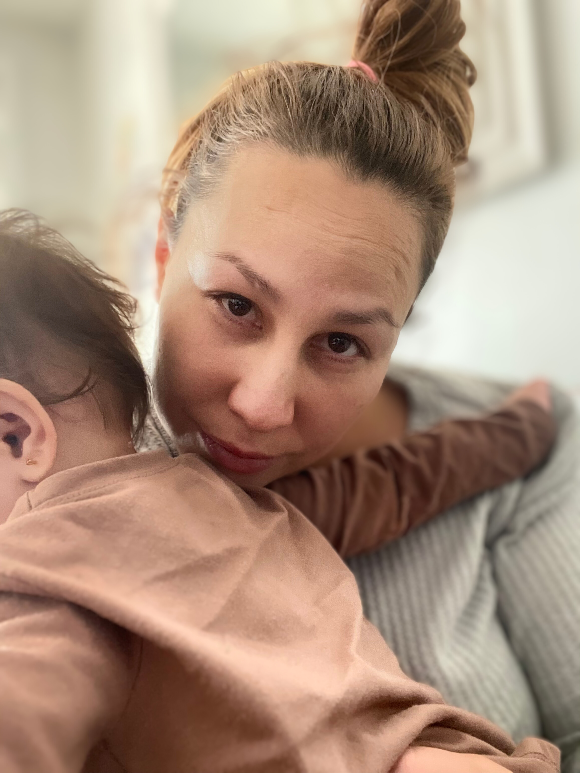 Vianely Alvarez holding her child during a vulnerable moment — reflecting her journey from severe depression to healing through mindfulness and spiritual practices.